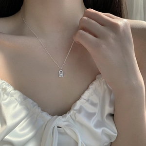 Sparkling diamond lock pendant necklace in sterling silver with princess cut cubic zirconia