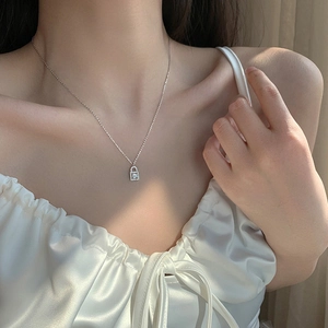 Sparkling diamond lock pendant necklace in silver with square cut center stone for women