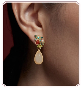 Detailed close-up of ethnic butterfly earrings with nephrite jade drop and cloisonne enamel