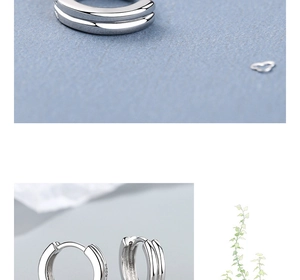 Gros plan sur les boucles d'oreilles double couche en argent S925 avec finition miroir poli
