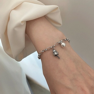 Retro silver chain bracelet with cute mushroom pendant and round bead on female wrist