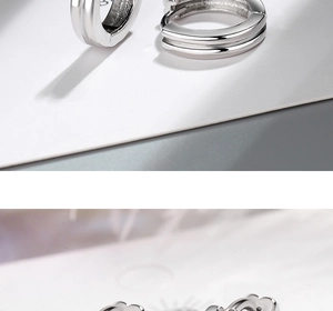 Gros plan de boucles d'oreilles en argent à double couche et bordure ondulée polie brillante