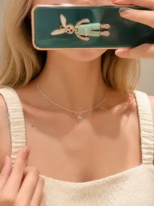 Close-up of double-layered S925 silver plated heart pendant necklace on a woman neck