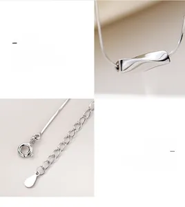 Détail macro du collier géométrique en argent S925 avec pendentif torsadé et chaîne serpent