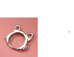Macro shot of S925 sterling silver cat-shaped hoop earrings with hollow cat ear details