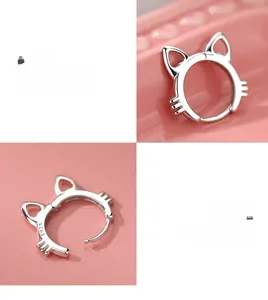 Detailed macro view of S925 sterling silver cat-shaped hoop earrings with polished finish