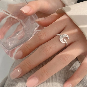 Minimalist silver moon ring with hammered texture and adjustable open band design