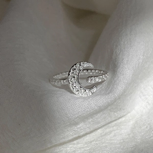 Textured moon ring in silver finish with micro-pave zircons and open adjustable band