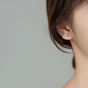 Olive green marquise crystal stud earrings for women with a minimalist metal design