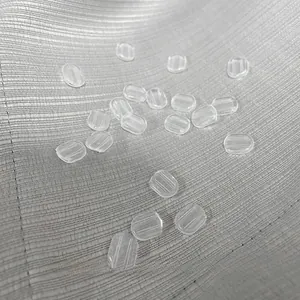 Close-up of clear anti-slip silicone pads for clip-on earrings with textured grip