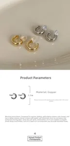 Detail view of 1.2cm copper ear cuffs in gold and silver plating with resin pads