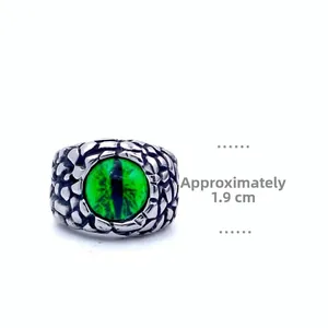 Macro detail of vintage dragon eye ring with green stone inlay and scale texture