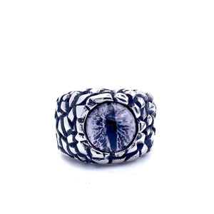 Detail of vintage dragon eye ring with blue stone and dragon scale textured steel band