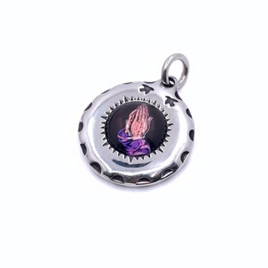Silver stainless steel prayer hands pendant with colorful inlay and bird relief details