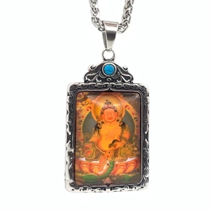 Pendentif thangka Kubera tibétain en acier inoxydable avec motifs et turquoise bleue