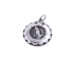 Polished titanium steel praying hands pendant necklace in a round silver vintage design