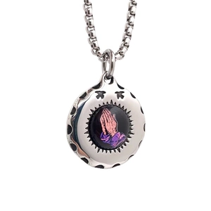 Vintage stainless steel round pendant necklace featuring praying hands art on box chain