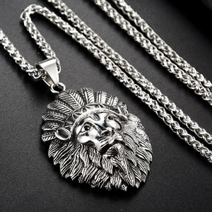 Close-up of vintage silver lion head pendant with Indian feathered headdress and thick chain