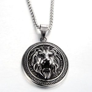 Detailed close-up of retro lion head relief pendant on a thick titanium steel chain necklace