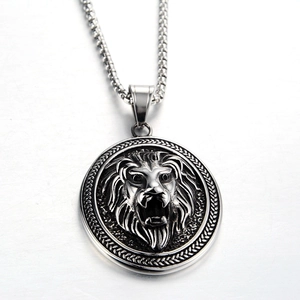 Detailed macro view of retro lion head embossed circular steel pendant with rope border