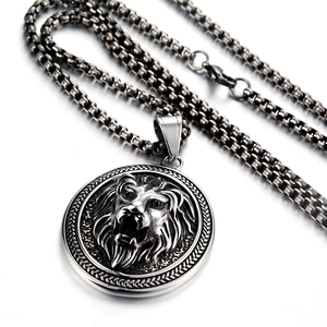 Macro shot of silver stainless steel lion pendant with bold box chain texture