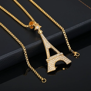 Collier avec pendentif Tour Eiffel doré, orné de strass brillants et d'une étoile
