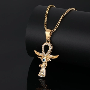 Gold plated stainless steel Ankh necklace featuring Eye of Horus and crystal wings