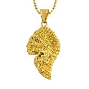 Macro detail of gold-plated Indian skull pendant with intricate feather textures on bead chain