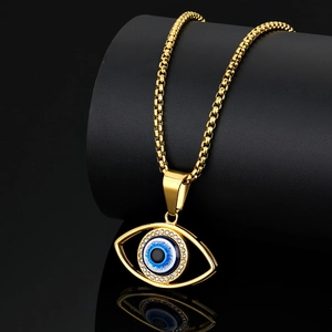 Golden Evil Eye pendant necklace with blue enamel and sparkling crystals on a box chain