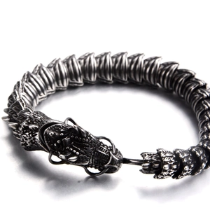 Close-up of vintage dragon scale link bracelet with a detailed dragon head clasp
