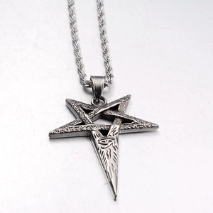Macro view of punk star pendant with Eye of Horus relief on a braided chain