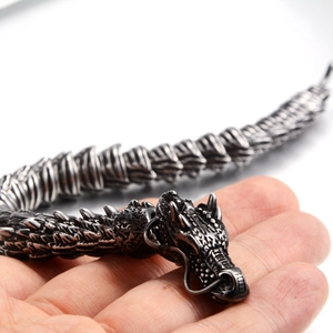 Macro detail of a vintage dragon-shaped titanium steel bracelet with scales