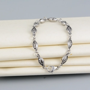 Vintage silver devil eye bracelet made of titanium steel with retro engraved metal links