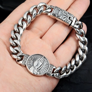 Vintage stainless steel Cuban link bracelet with praying hands medallion and Greek key details