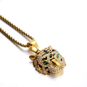 Collier avec pendentif tête de tigre en acier inoxydable doré aux yeux verts et cristaux