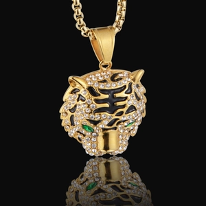 Collier hip hop en acier titane doré avec pendentif tigre aux yeux verts et cristaux