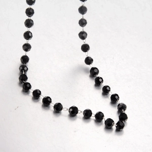 Minimalist titanium steel necklace with multifaceted black beads and silver metal chain links