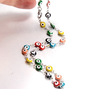 Colorful evil eye beaded necklace with silver chain for women featuring multi-color charms