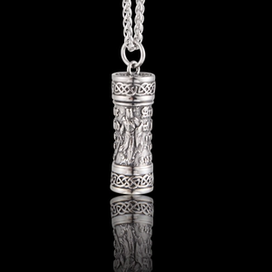 Detail of vintage silver warrior cylinder pendant with Celtic knot and woven chain
