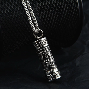Detailed relief carving on cylindrical perfume bottle pendant with Celtic patterns