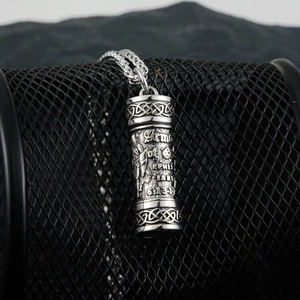 Detailed relief of Armor of God warrior and biblical text on steel pendant