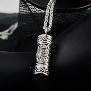 Detail of Armor of God engraving and Celtic knots on stainless steel cylinder pendant