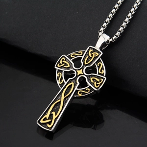 Detailed view of the Celtic Knot Cross pendant with vintage silver and gold finish accents