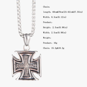 Detailed view of vintage silver iron cross pendant with relief texture and size chart