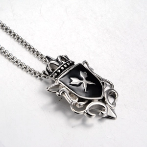 Retro shield necklace with crown and cross motif in vintage silver finish for men