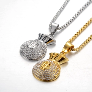 Close-up of hip hop money bag pendants with sparkling rhinestones and dollar signs