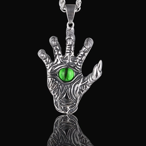 Gothic silver skeletal hand pendant necklace with green evil eye bead and vintage finish