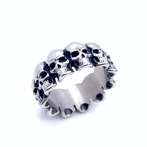 Detailed macro view of retro stainless steel skull ring with embossed vintage finish