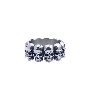 Retro stainless steel ring for men featuring a full band of detailed gothic skulls