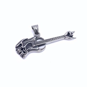 Macro detail of rock punk guitar skull pendant in vintage silver titanium steel